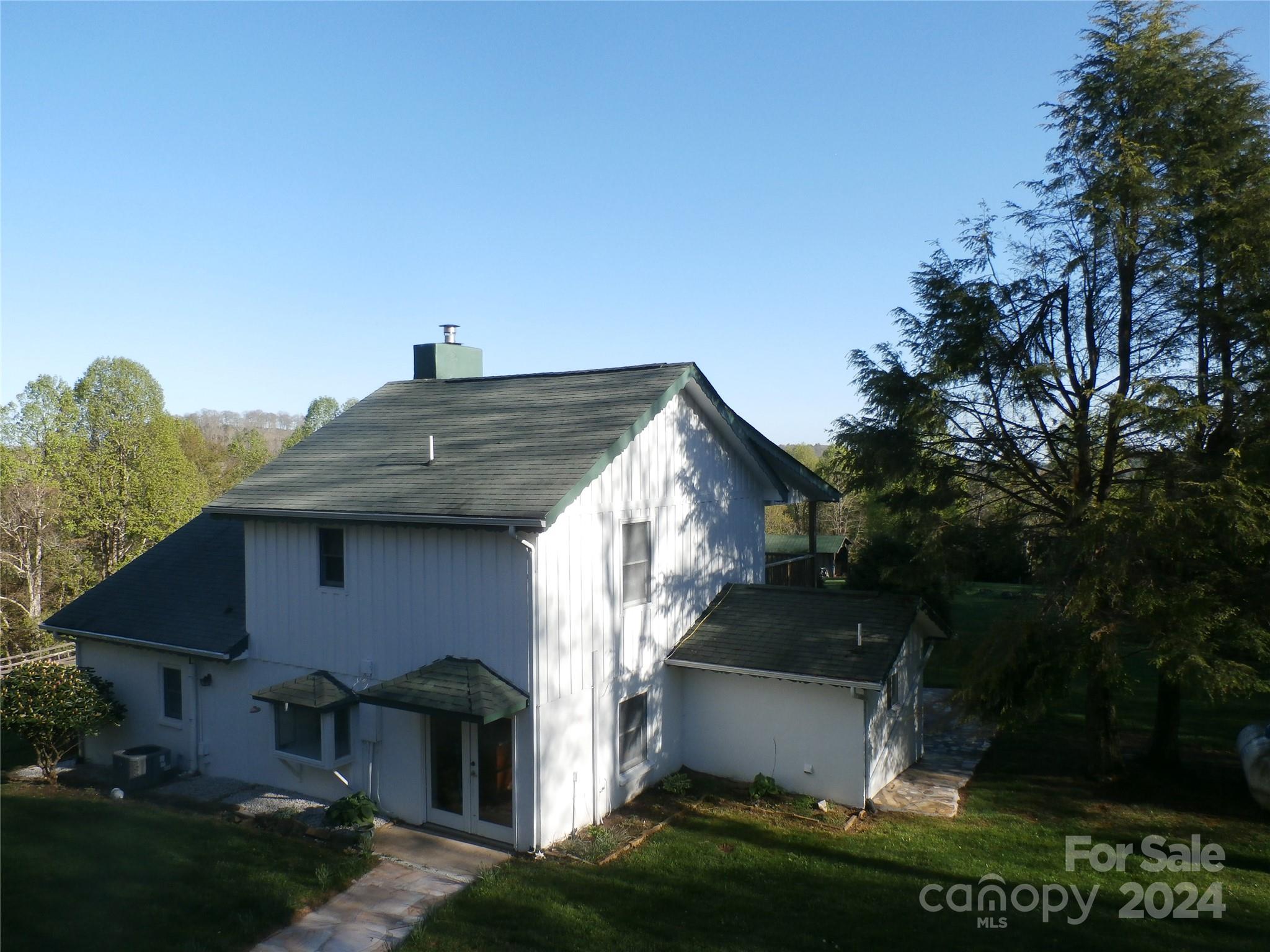 288 Firetower Road Spruce Pine, NC 28777 - Photo 18 of 47 a front view of a house with a yard
