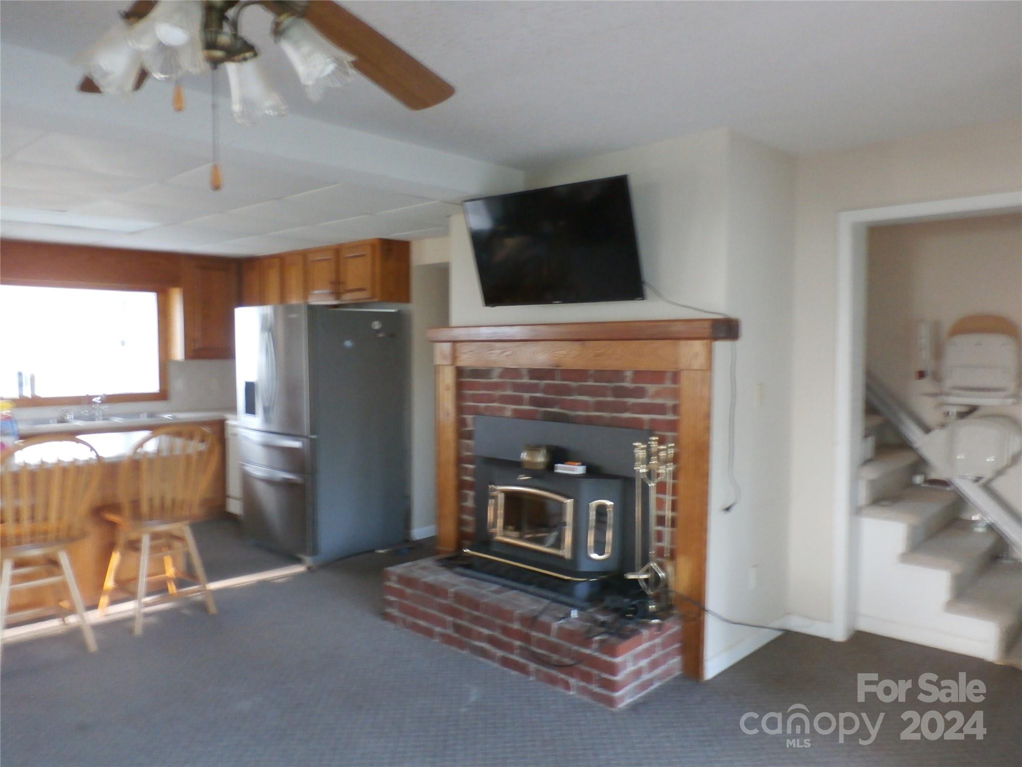 288 Firetower Road Spruce Pine, NC 28777 - Photo 8 of 47 a living room with furniture and a fireplace