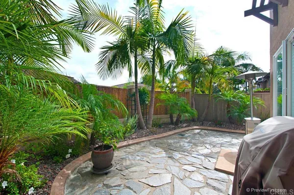 a view of a backyard with garden