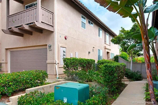 a view of a building with a yard