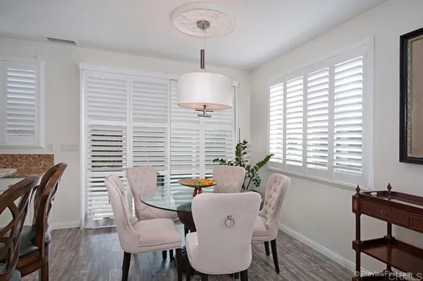 a dining room with furniture and window