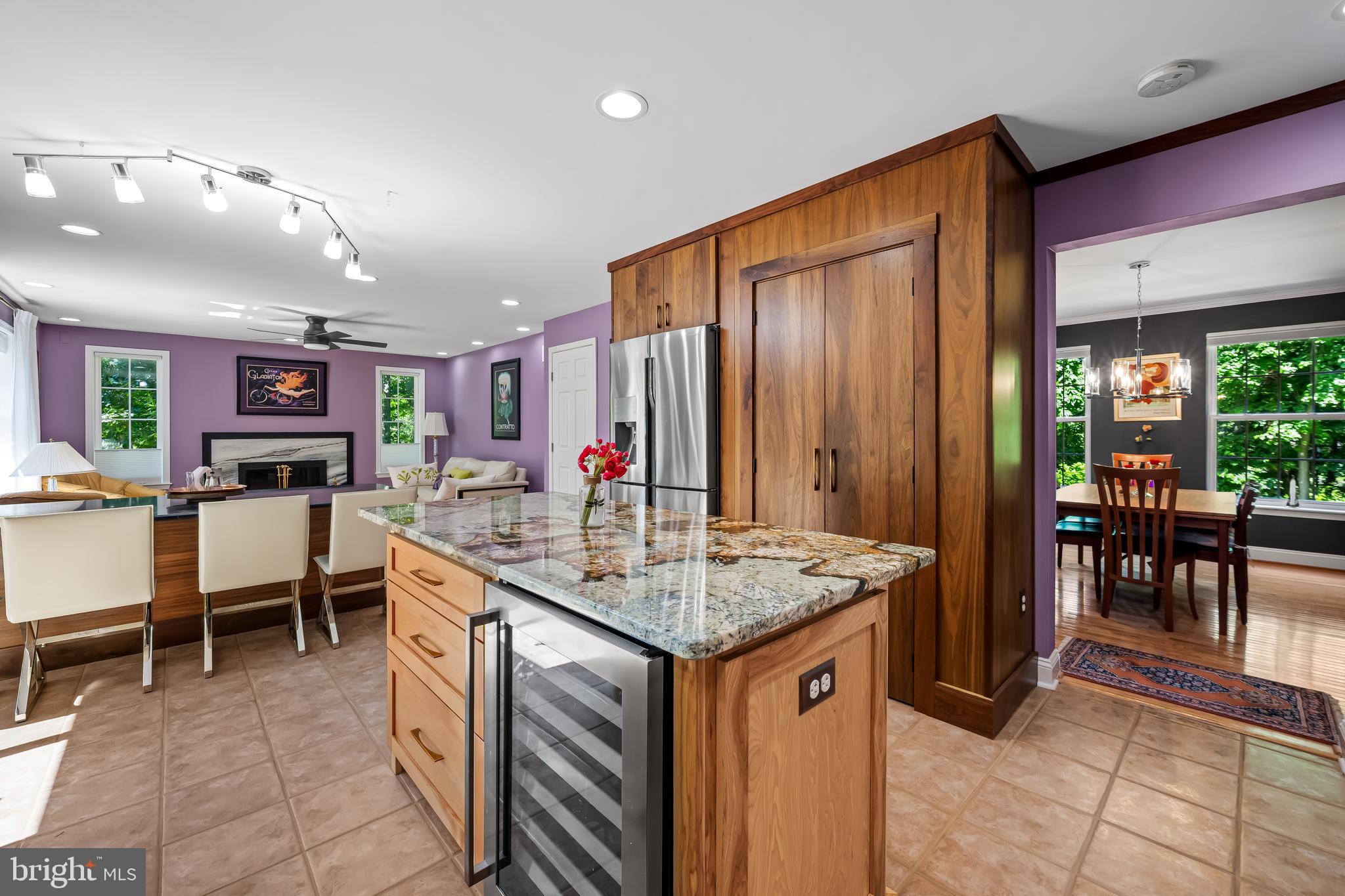 5026 Mt Carmel Road Hampstead, MD 21074 - Photo 15 of 57 a kitchen with kitchen island granite countertop a table chairs sink and cabinets