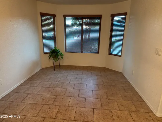 a kitchen with a stove sink and cabinets