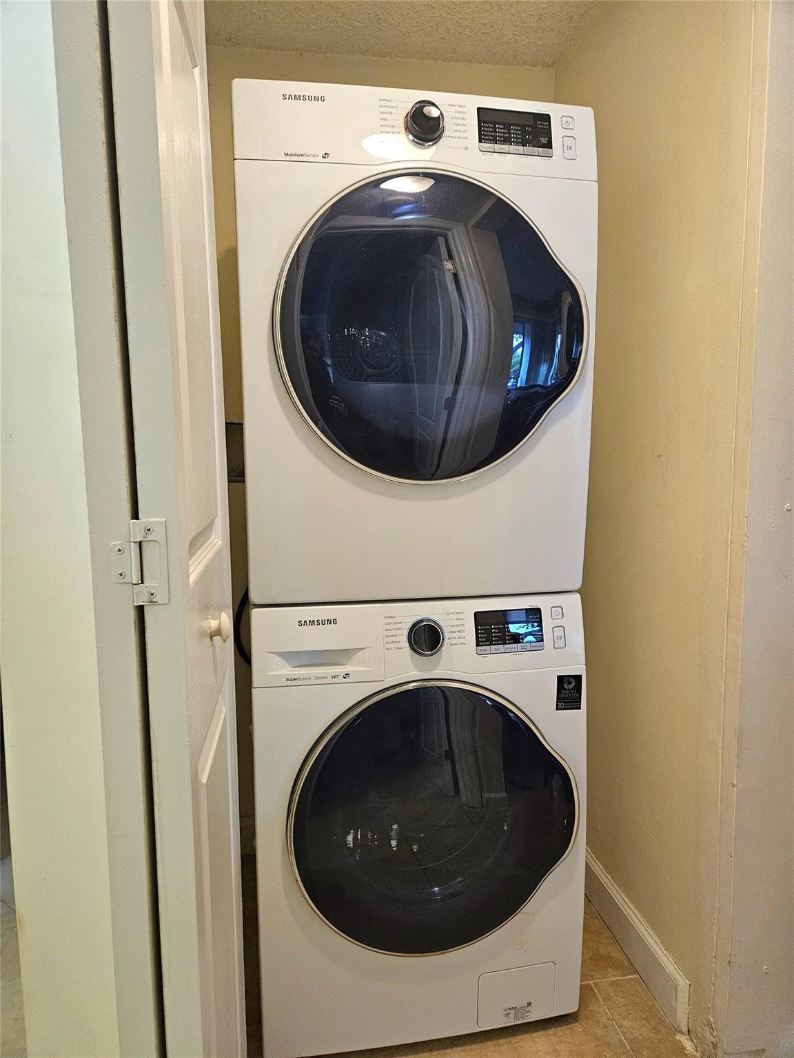 701 Lyons Road, Unit 13205 Coconut Creek, FL 33063 - Photo 15 of 37 a utility room with dryer and washer