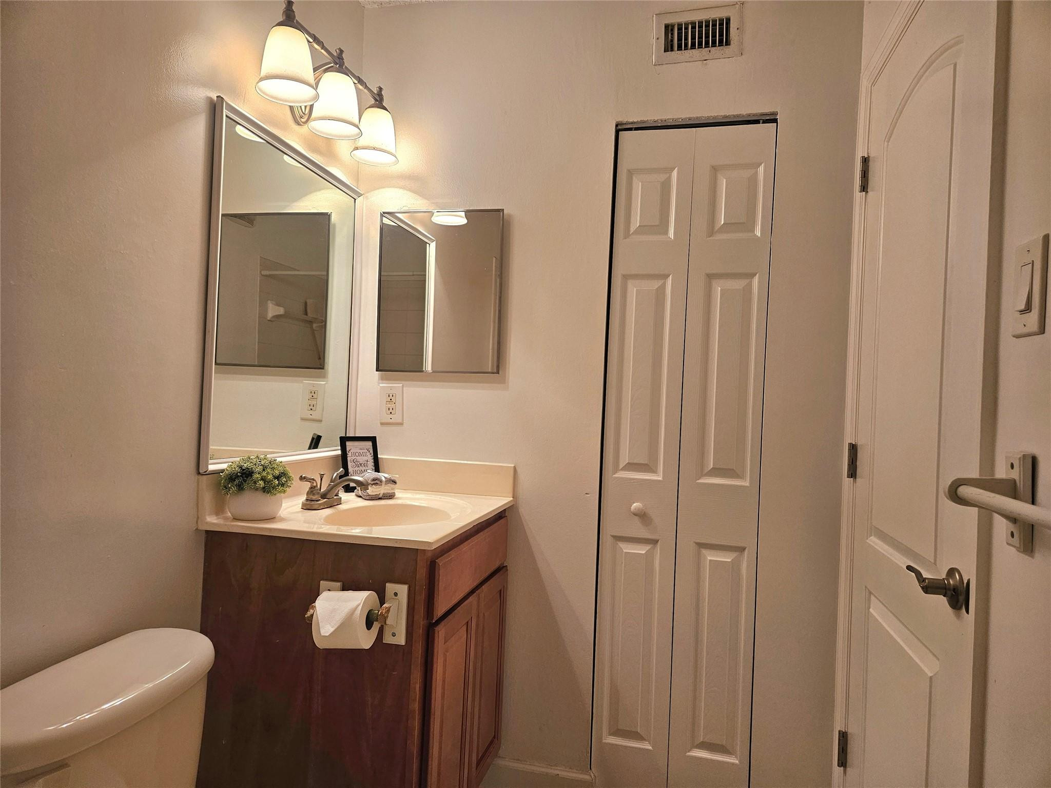 701 Lyons Road, Unit 13205 Coconut Creek, FL 33063 - Photo 18 of 37 a bathroom with a sink a toilet and shower