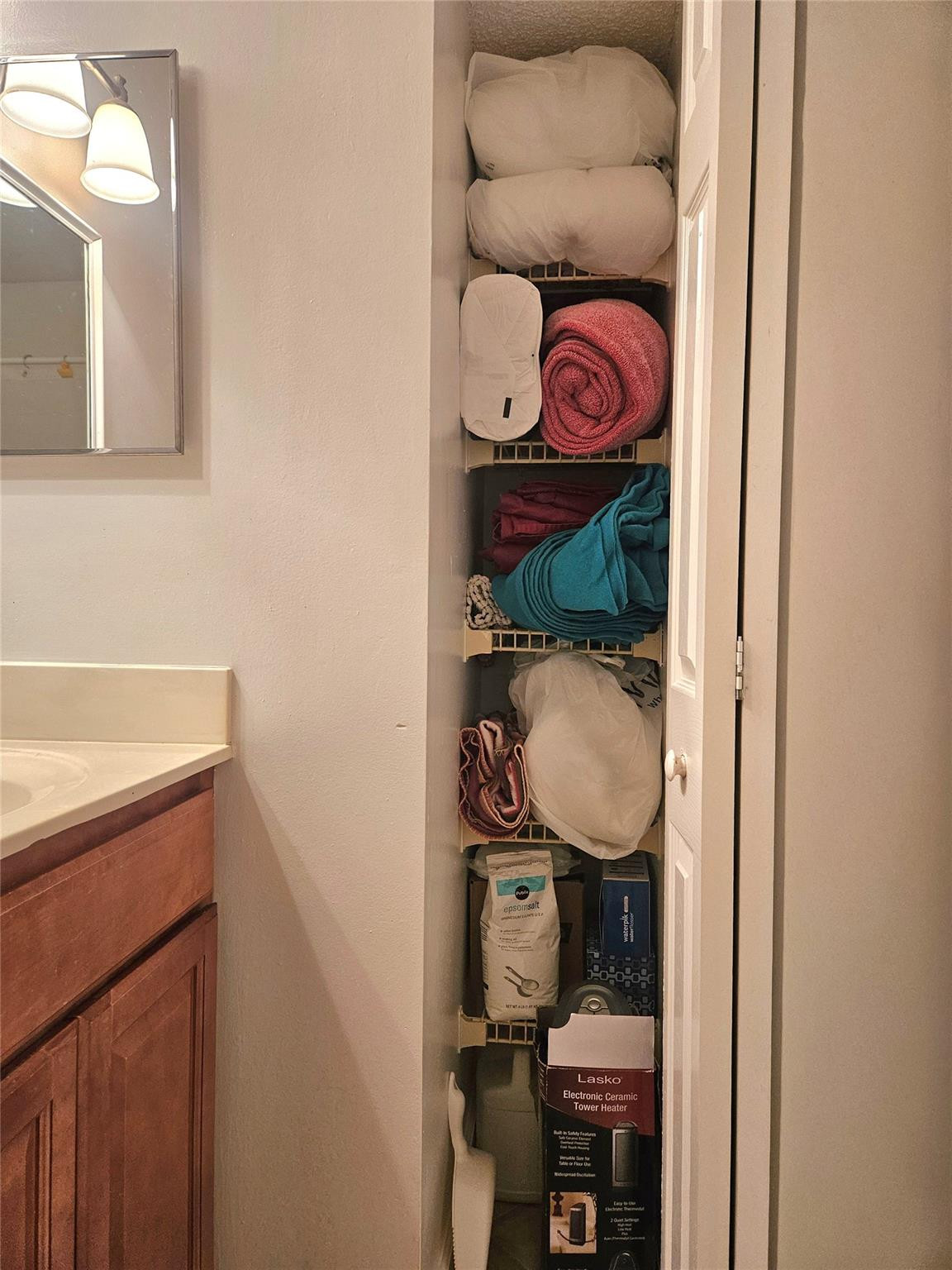 701 Lyons Road, Unit 13205 Coconut Creek, FL 33063 - Photo 19 of 37 a bathroom with a sink and a mirror