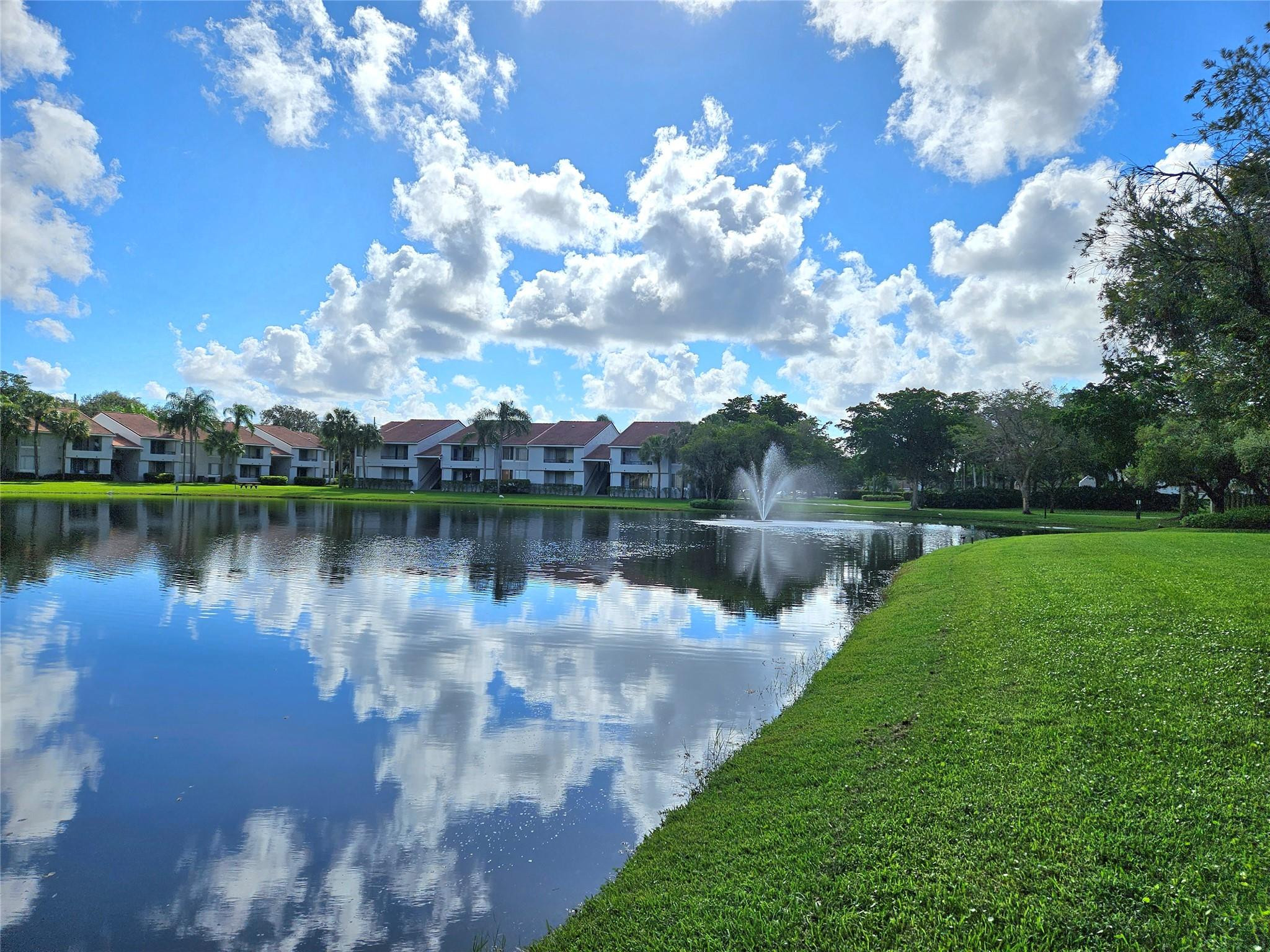 701 Lyons Road, Unit 13205 Coconut Creek, FL 33063 - Photo 22 of 37 a view of a lake in middle of a lake view