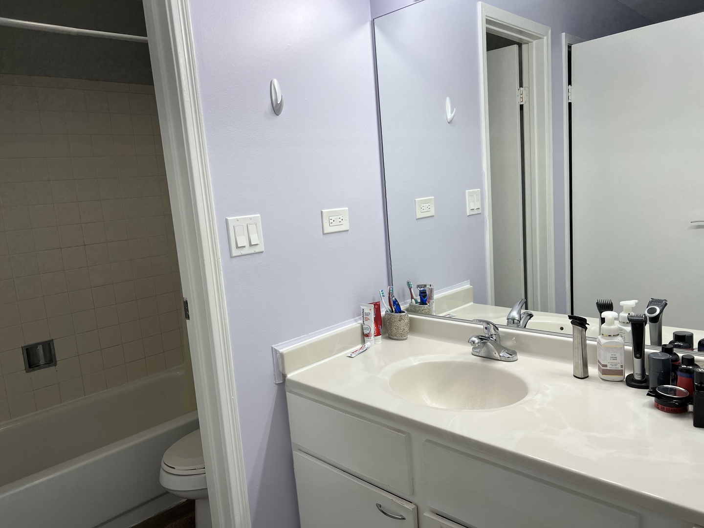 1931 North Hicks Road, Unit 211 Palatine, IL 60074 - Photo 16 of 18 a bathroom with a sink toilet and shower