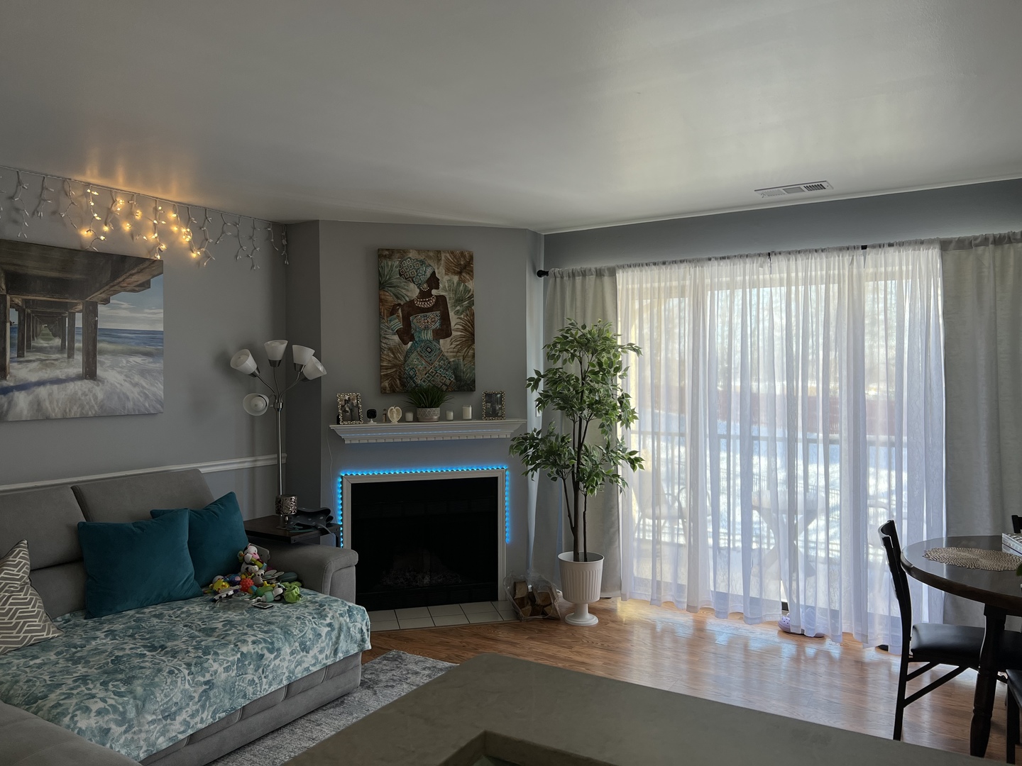 1931 North Hicks Road, Unit 211 Palatine, IL 60074 - Photo 2 of 18 a living room with furniture and a fireplace
