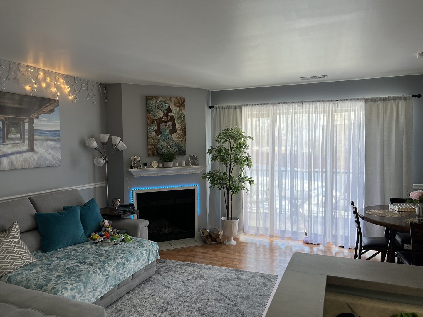 1931 North Hicks Road, Unit 211 Palatine, IL 60074 - Photo 3 of 18 a living room with furniture and a fireplace