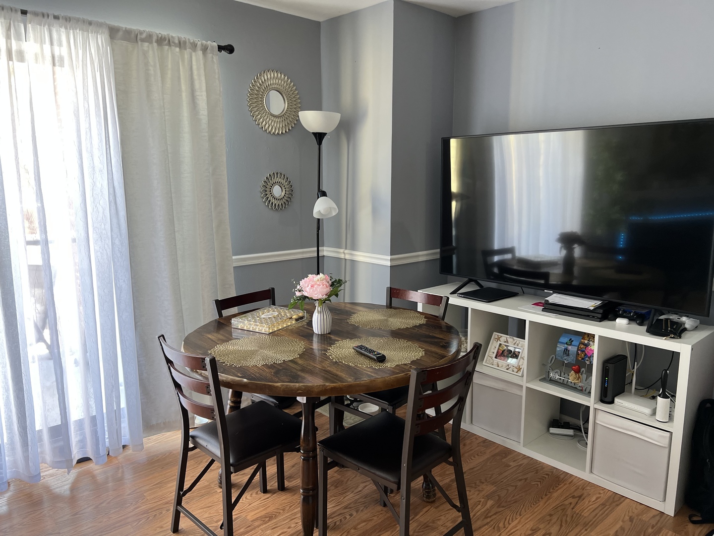 1931 North Hicks Road, Unit 211 Palatine, IL 60074 - Photo 4 of 18 a view of a dining room with furniture and wooden floor