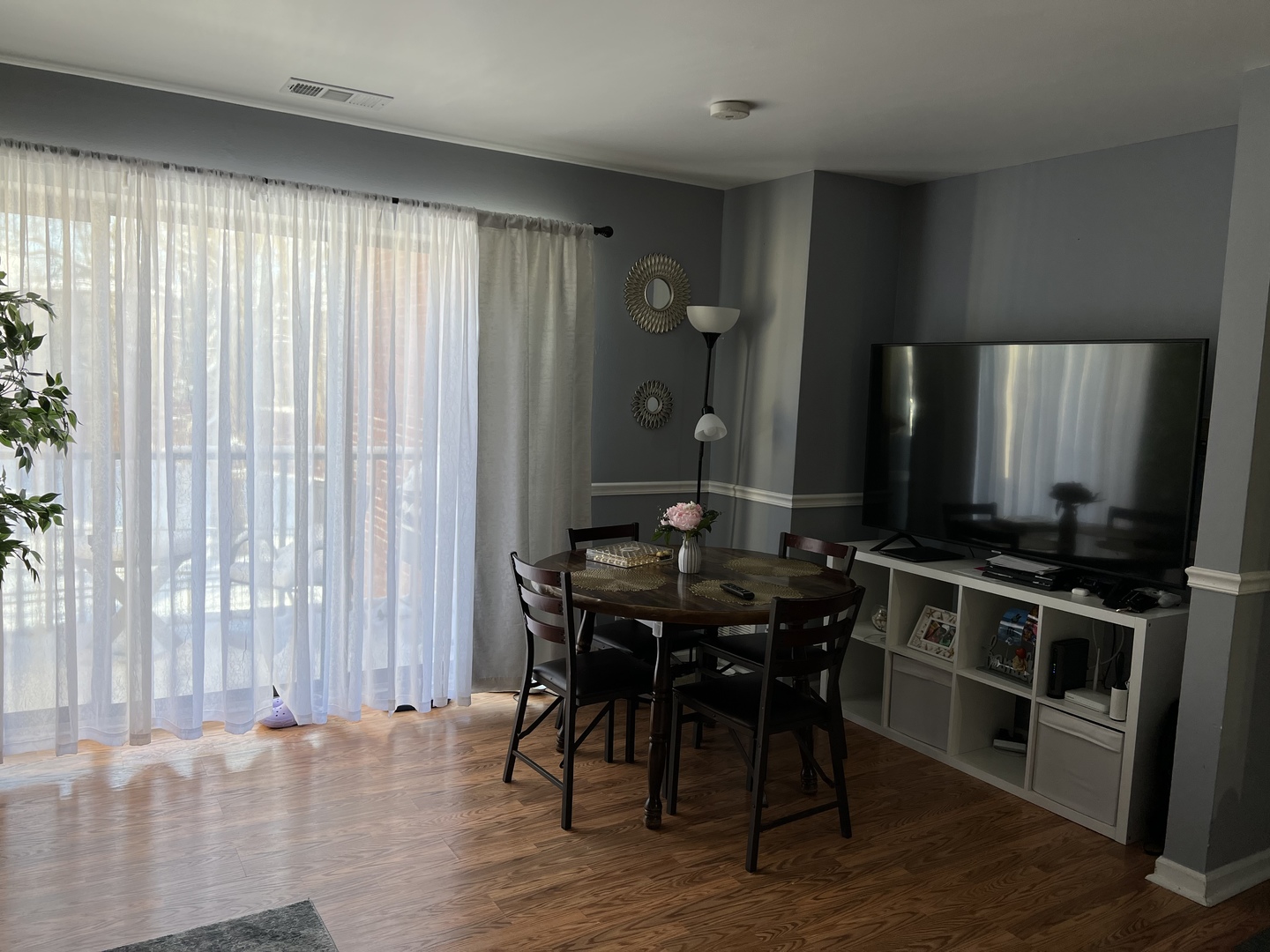 1931 North Hicks Road, Unit 211 Palatine, IL 60074 - Photo 7 of 18 an open kitchen with a table and chairs