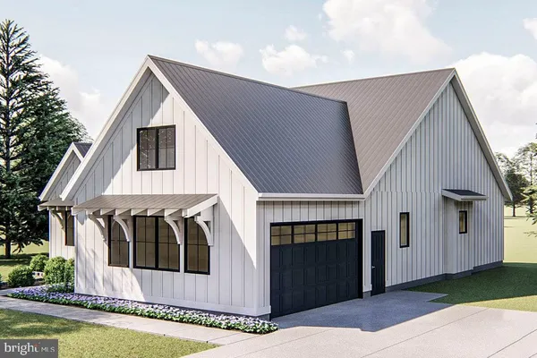 a front view of a house with garage