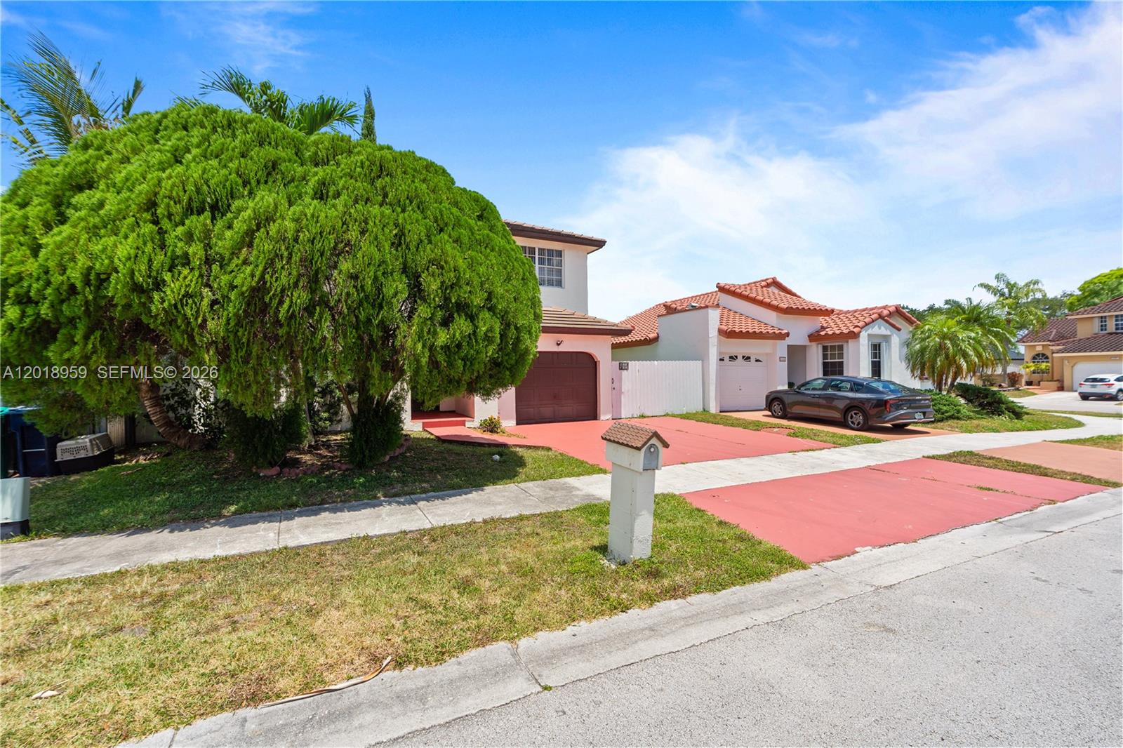 15345 Southwest 63rd Terrace Miami, FL 33193 - Photo 1 of 51 a front view of a house with a yard and garage