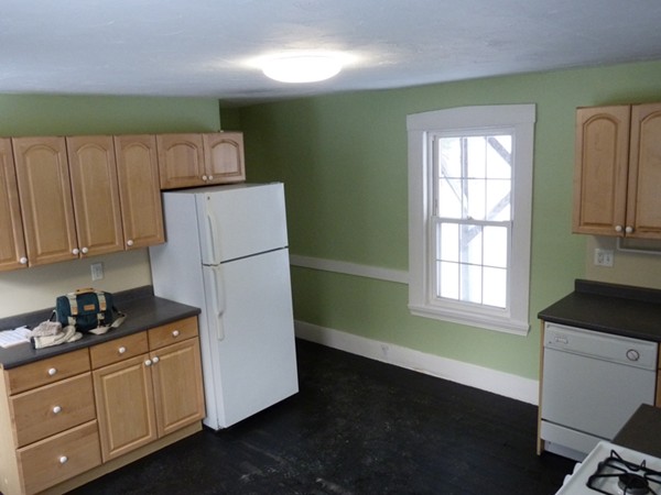 478-480 Gleasondale Road Stow, MA 01775 - Photo 3 of 10 a kitchen with cabinets appliances a sink and a window