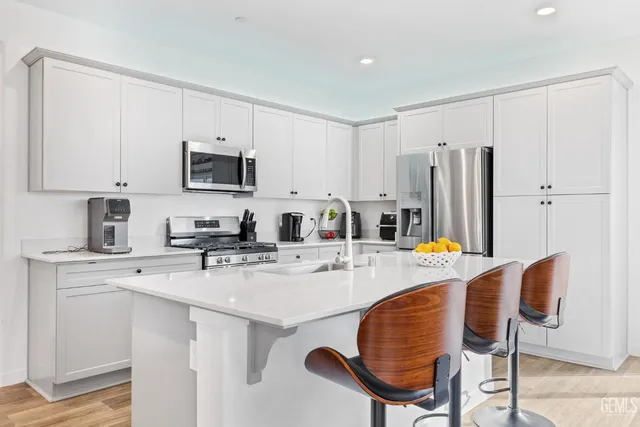 a view of a dining room with furniture and window