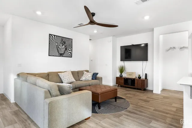 a kitchen with stainless steel appliances white cabinets and stove
