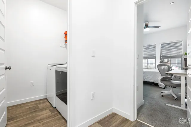 a bathroom with a granite countertop sink mirror and shower