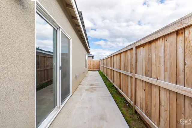 a bedroom with furniture and a rug