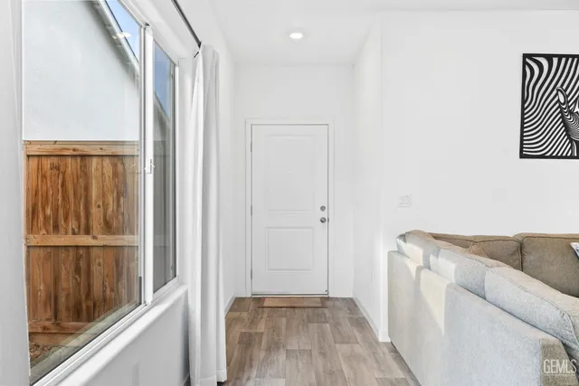 a view of front door with wooden floor