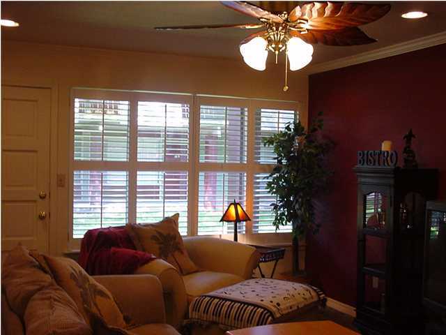 210 Pelham Road, Unit B104 Fort Walton Beach, FL 32547 - Photo 4 of 9 a living room with furniture and a large window