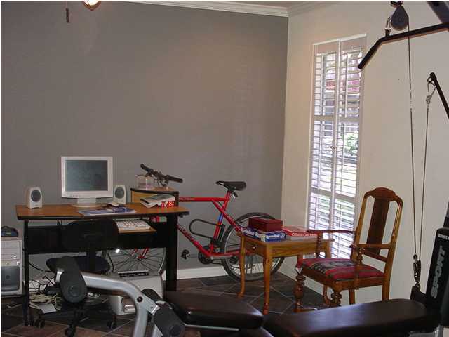 210 Pelham Road, Unit B104 Fort Walton Beach, FL 32547 - Photo 9 of 9 a view of a workspace with furniture and a window