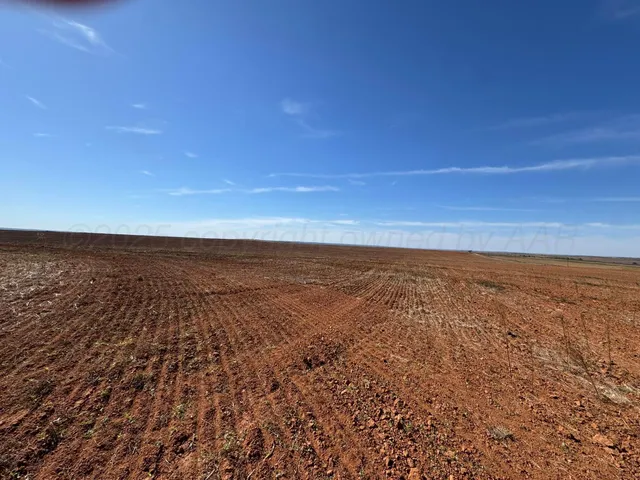an aerial view of residential houses with ocean view