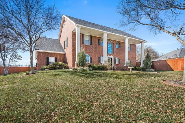 front view of house with a yard