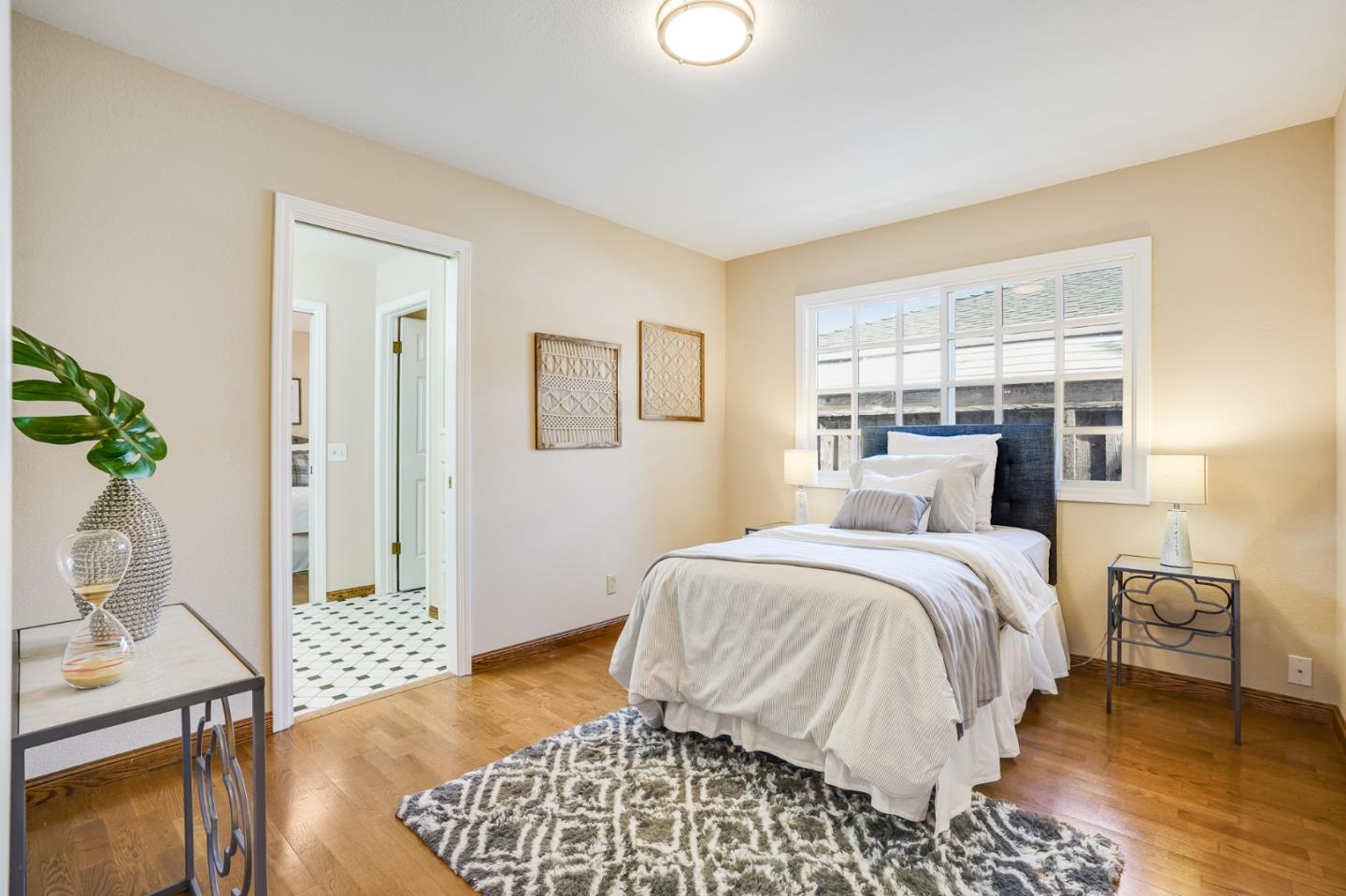 715 Pineview Drive San Jose, CA 95050 - Photo 18 of 34 a bedroom with a bed and wooden floor