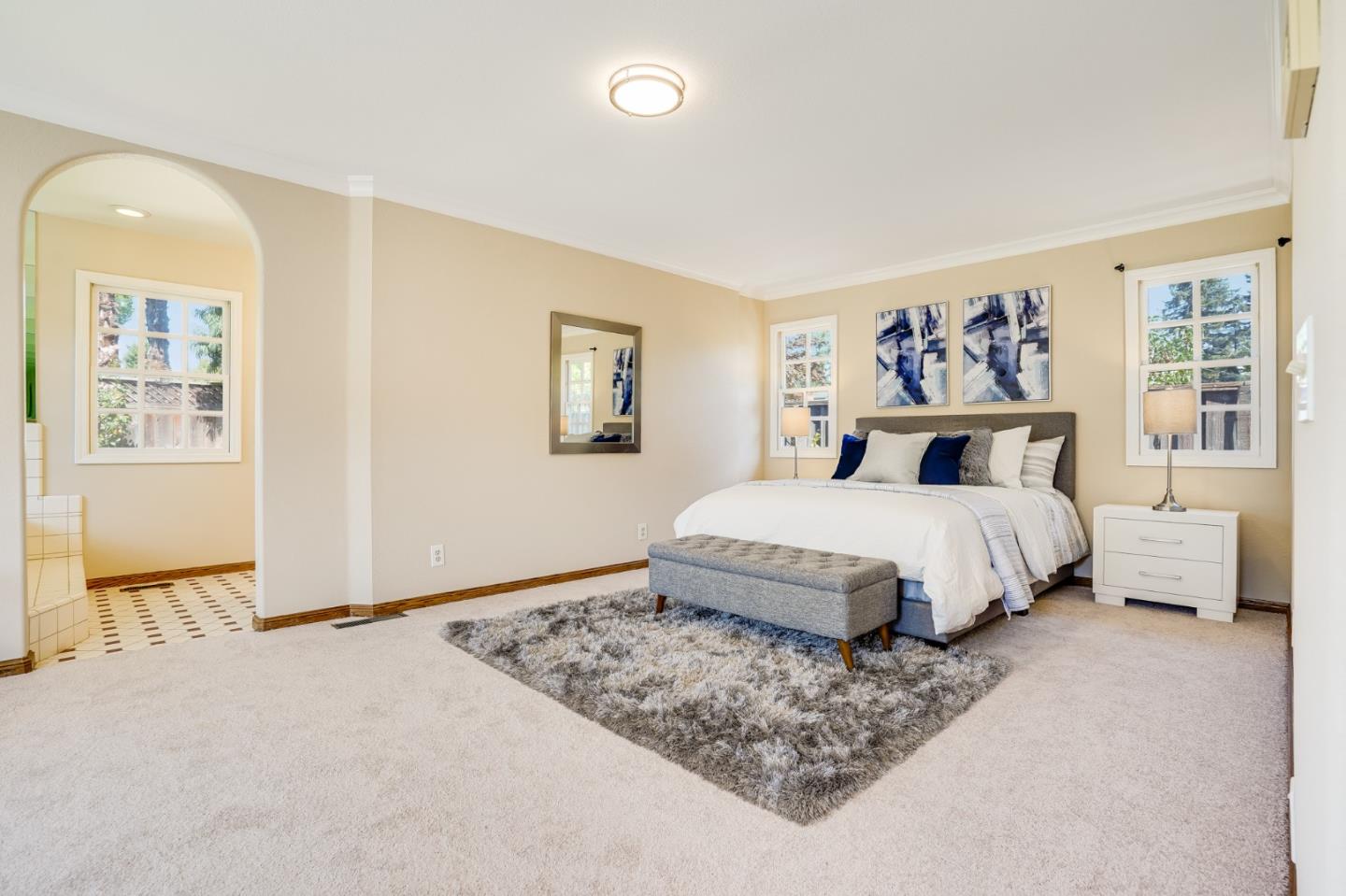 715 Pineview Drive San Jose, CA 95050 - Photo 23 of 34 a bedroom with a large bed and a painting on the wall