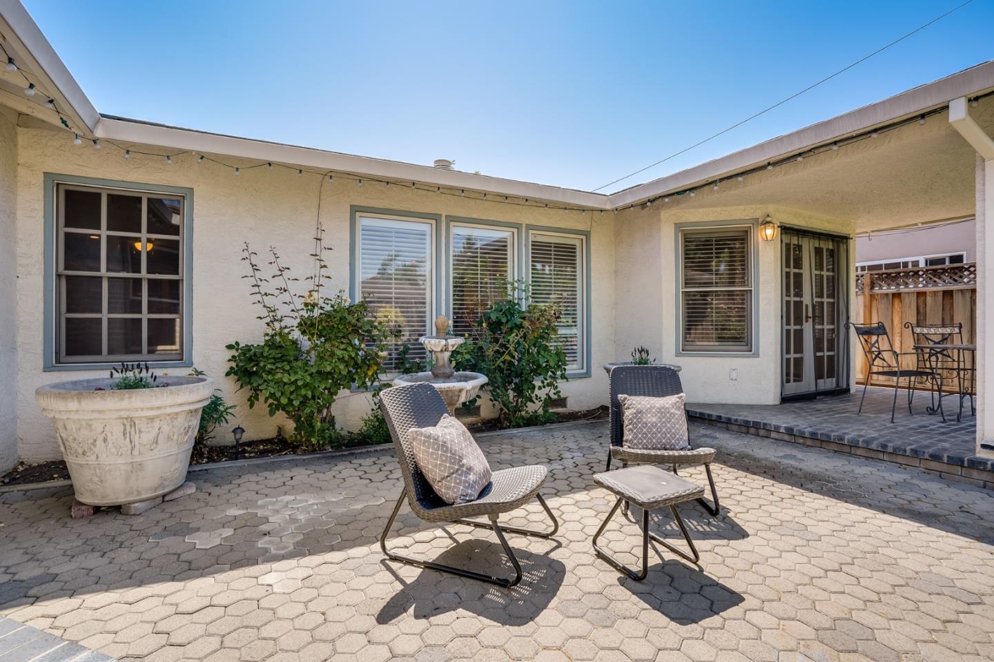 715 Pineview Drive San Jose, CA 95050 - Photo 27 of 34 a view of a patio with couple of chairs and a potted plant