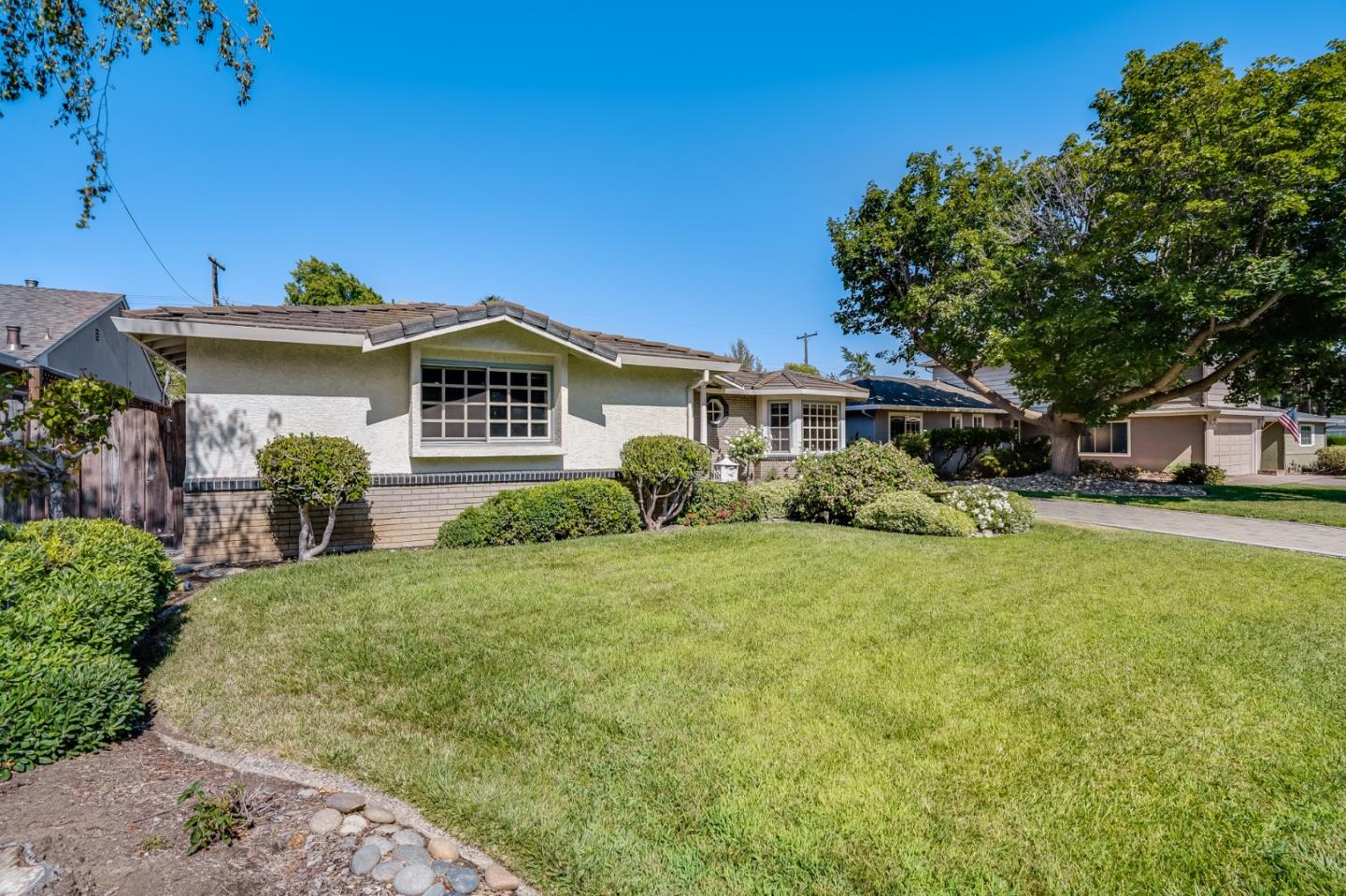 715 Pineview Drive San Jose, CA 95050 - Photo 4 of 34 a front view of a house with a yard