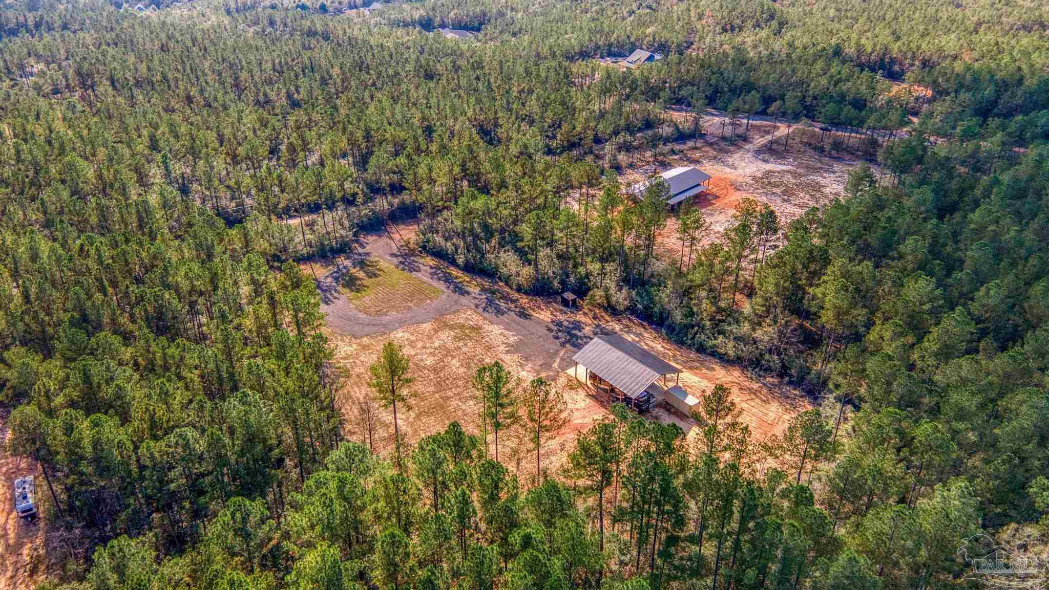 8030 Gin Road Milton, FL 32571 - Photo 2 of 13 a view of a yard with a tree