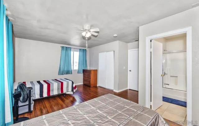a bedroom with furniture and a chandelier