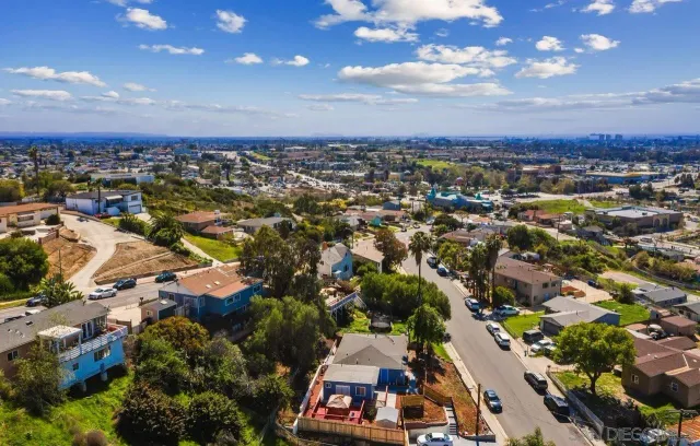 an aerial view of residential building with green space