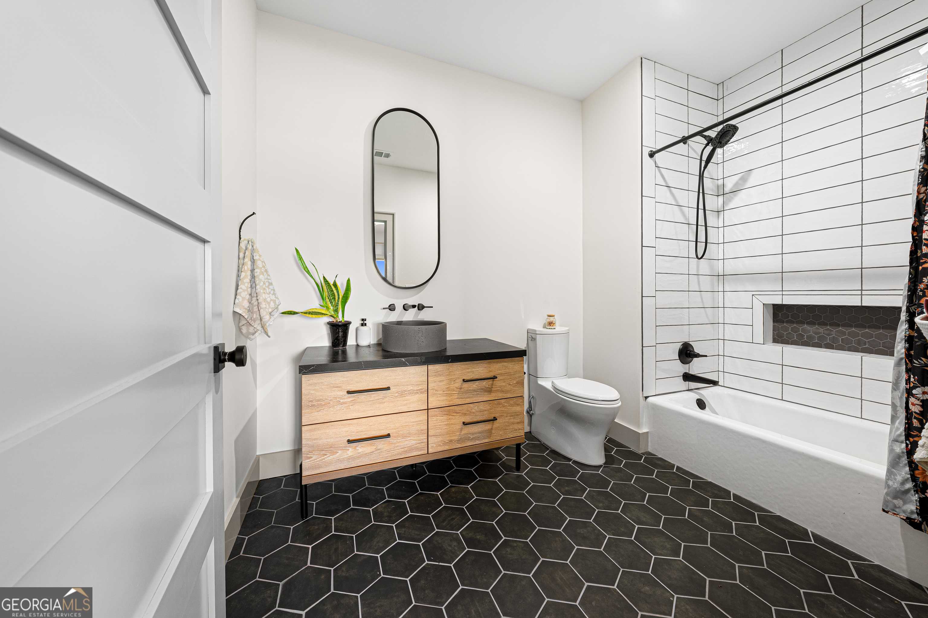 630 Human Road Bowman, GA 30624 - Photo 20 of 36 a bathroom with a double vanity sink toilet and shower