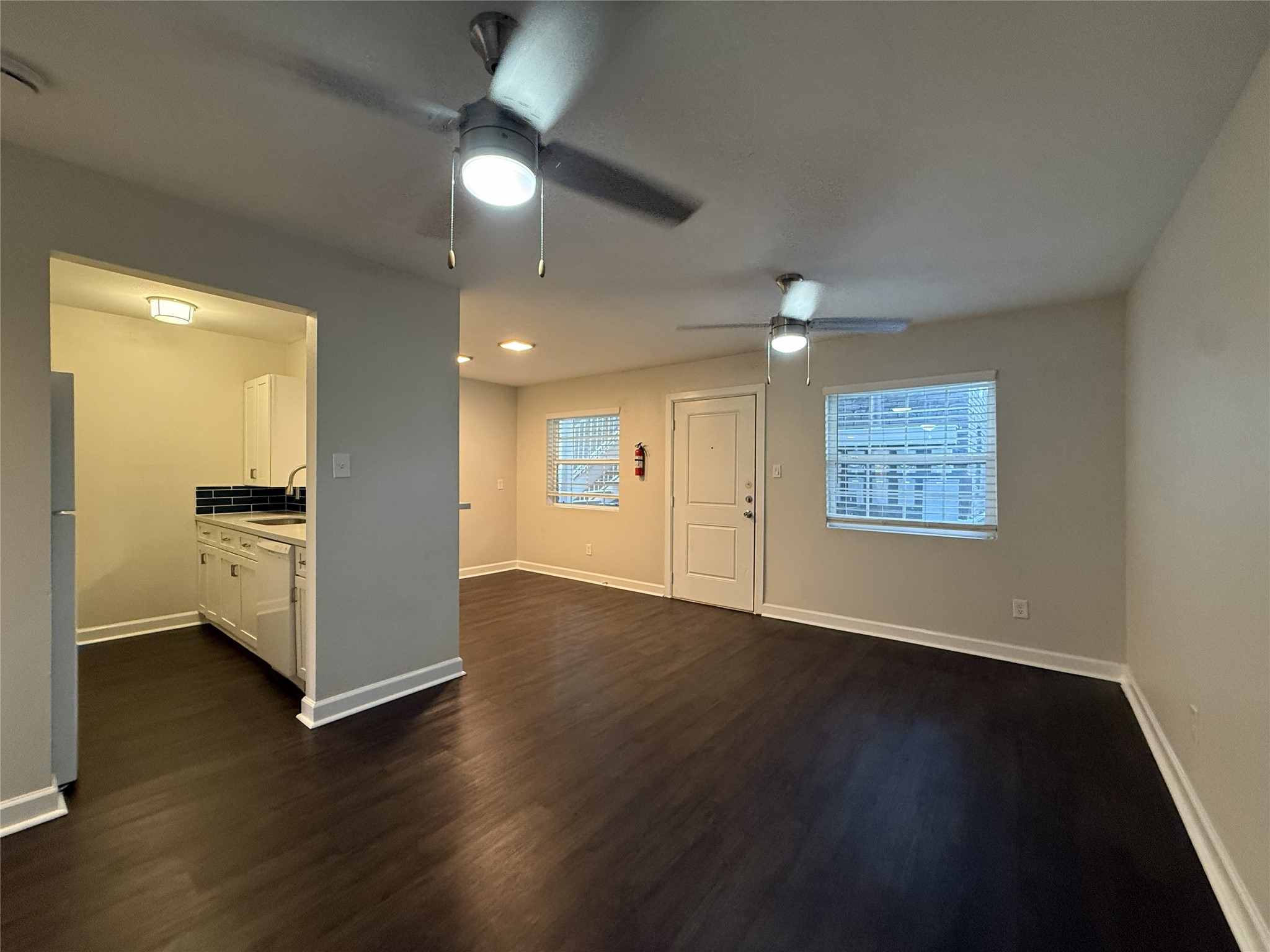 1824 Thonig Road, Unit 10 Houston, TX 77055 - Photo 4 of 17 an empty room with wooden floor and windows