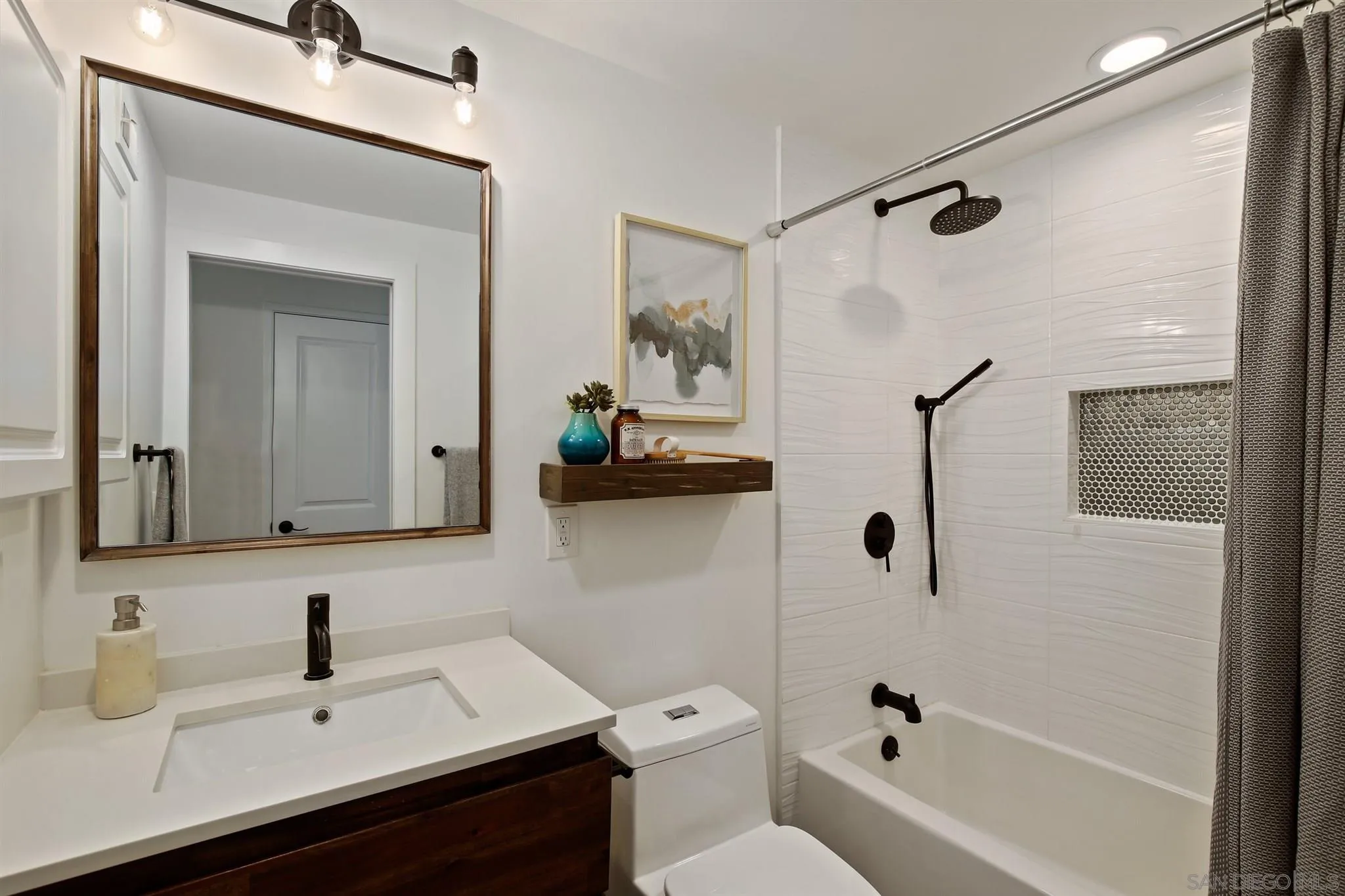 13432 Carriage Road Poway, CA 92064 - Photo 19 of 27 a bathroom with a sink a toilet and shower