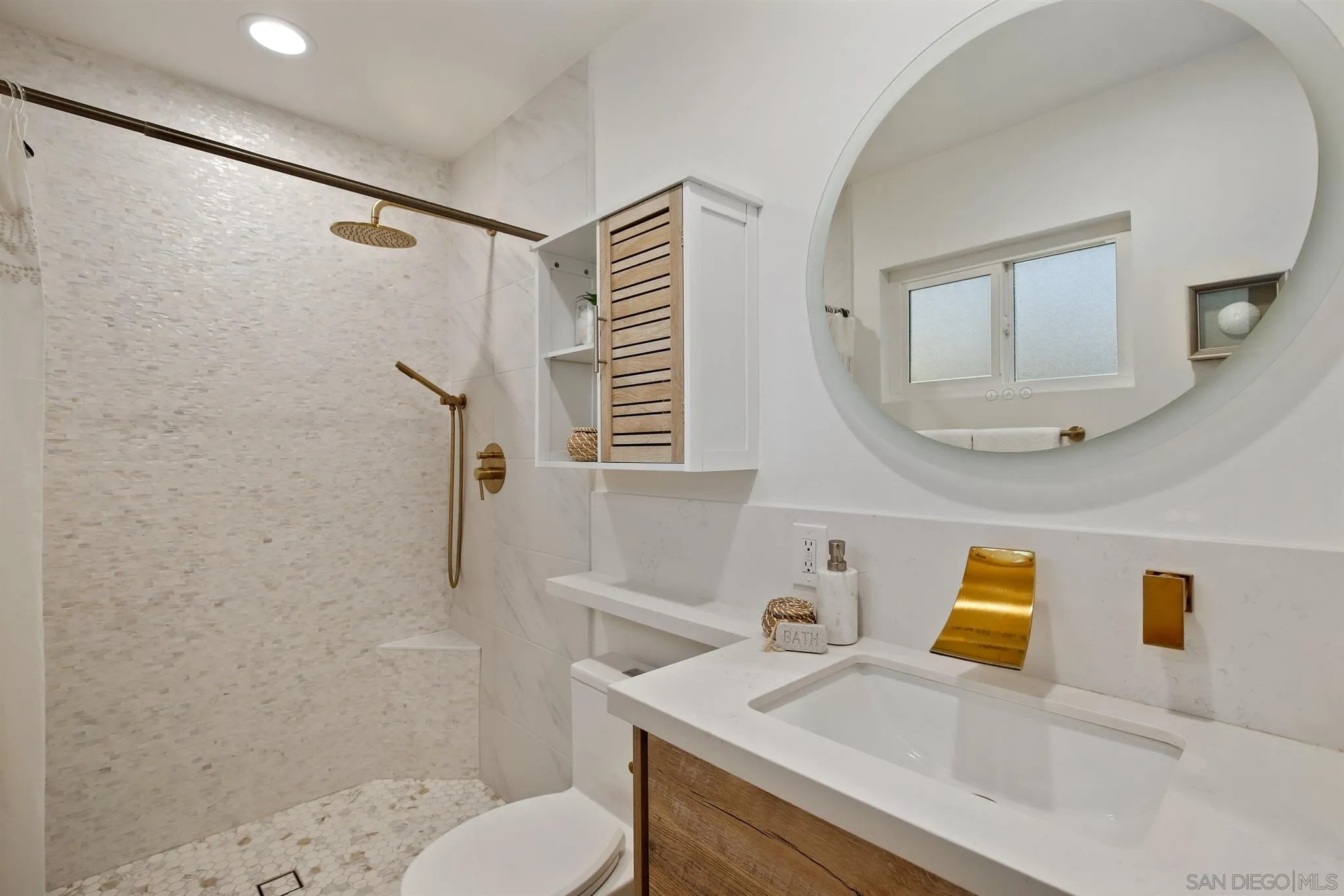13432 Carriage Road Poway, CA 92064 - Photo 20 of 27 a bathroom with a sink toilet and shower