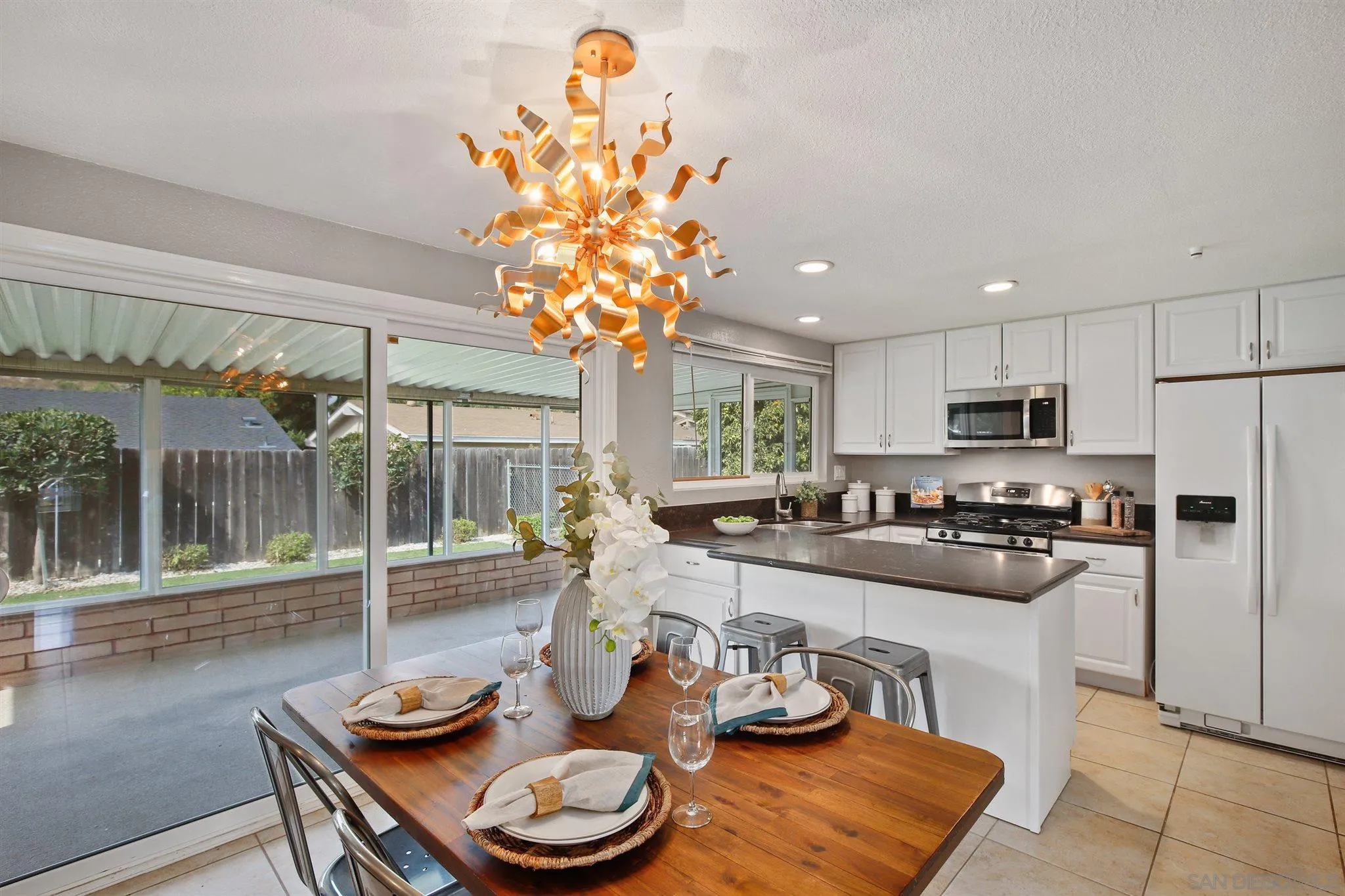 13432 Carriage Road Poway, CA 92064 - Photo 7 of 27 a kitchen with a table and chairs in it