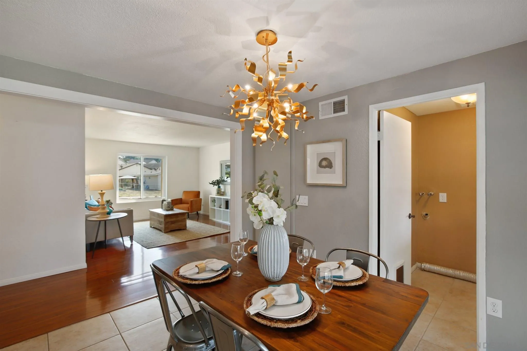 13432 Carriage Road Poway, CA 92064 - Photo 9 of 27 a dining room with furniture and chandelier