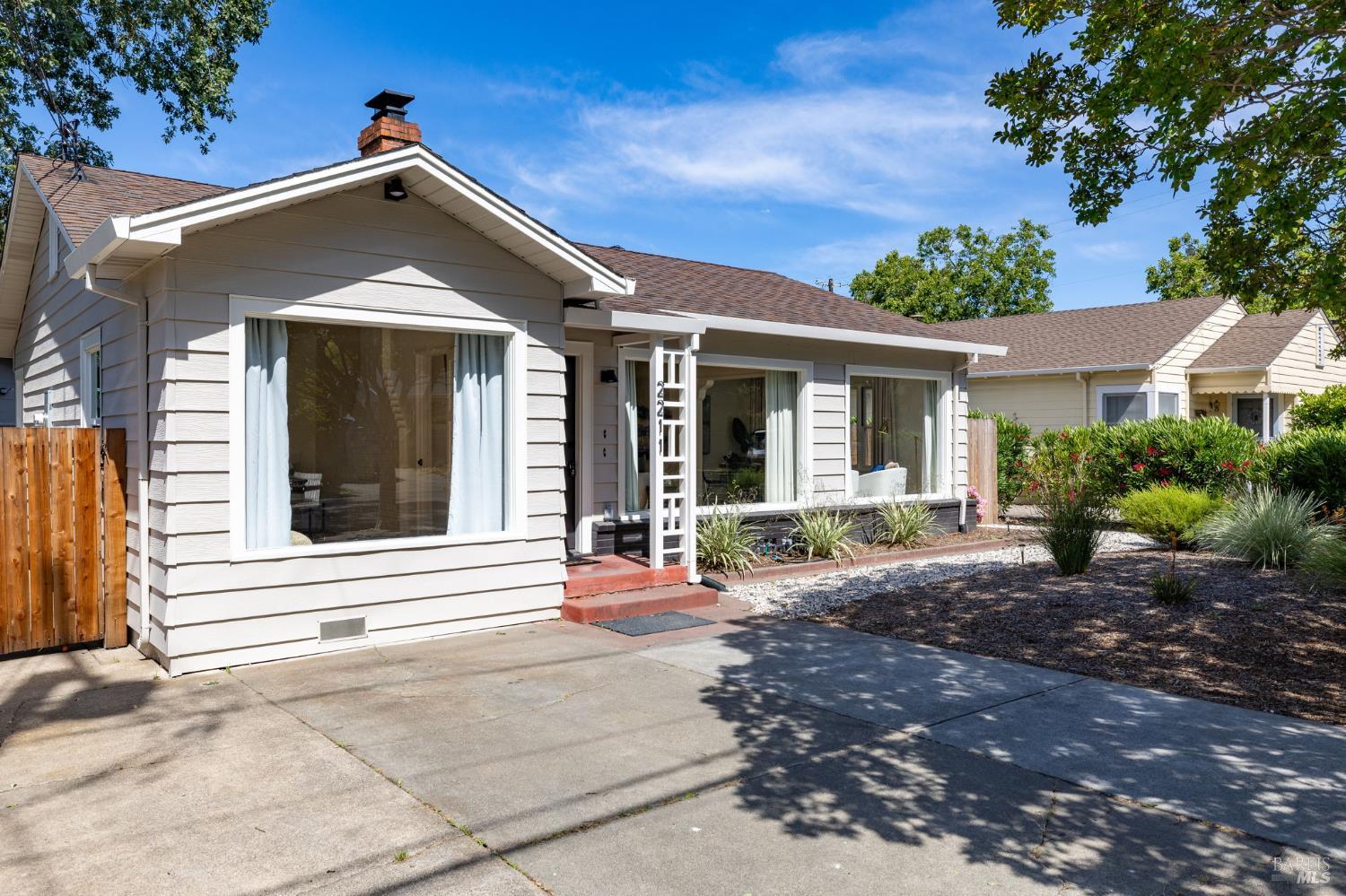 2211 Humboldt Street Santa Rosa, CA 95404 - Photo 3 of 52 a front view of a house with a yard