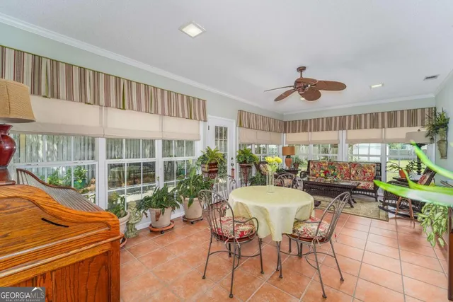 a view of a dining room with furniture window and outside view