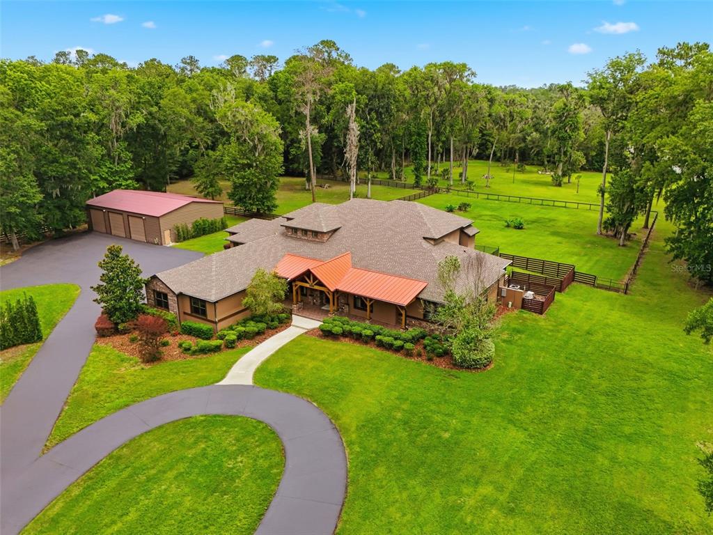 855 Southeast 87th Street Ocala, FL 34480 - Photo 70 of 79 an aerial view of a house with garden space and street view