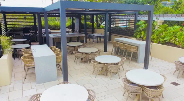 a outdoor dining space with furniture and outdoor view