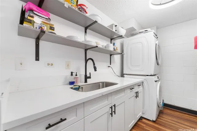 a kitchen with a sink and a refrigerator