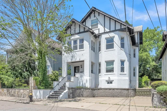 a front view of a house with a yard