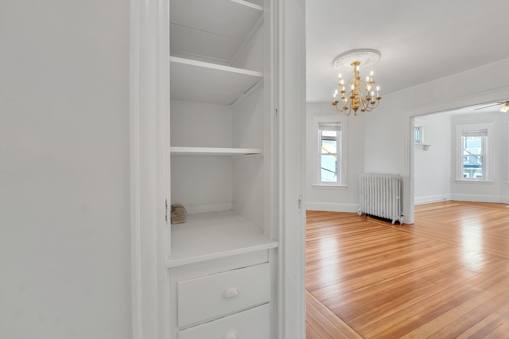 31 Justin Road, Unit 3 Boston, MA 02135 - Photo 12 of 32 a view of an empty room with wooden floor and a window