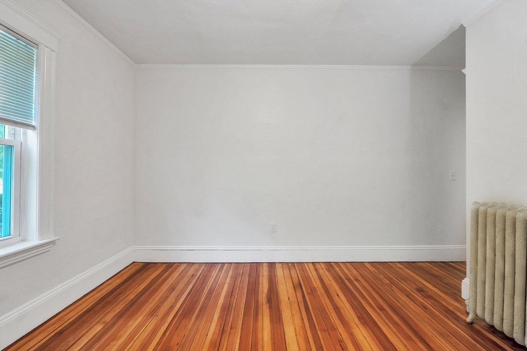 31 Justin Road, Unit 3 Boston, MA 02135 - Photo 14 of 32 a view of room with window and wooden floor