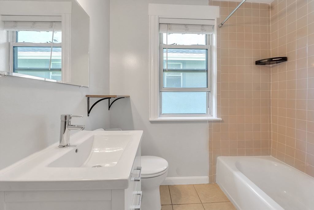 31 Justin Road, Unit 3 Boston, MA 02135 - Photo 17 of 32 a bathroom with a sink toilet and shower